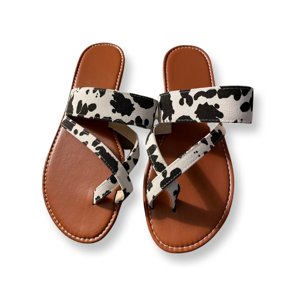 Cute cow print sandals. Band over bridge of foot measures 8-1/2 inches.